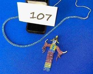 Blue sapphire necklace; gem-stone figure pin $25
