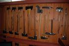 Dozens of vintage axes, hatchets, and primitive tools