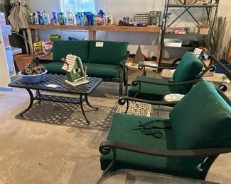 Three piece outdoor patio set....loveseat and 2 lounge chairs,  Iron coffee table