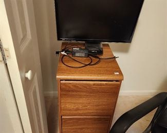 file cabinets and multiple computer monitors