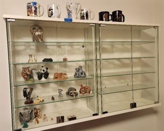 pair display cases with ceramic figurines
