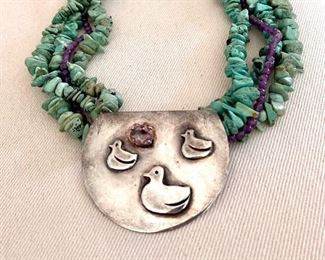 A one-of-a-kind sterling with an amethyst pendant hangs from this beautiful turquoise & amethyst necklace..