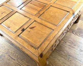 Carved knotty pine coffee table