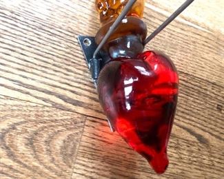 Tim Tate (founder Washington Glass Studio) wall-mounted  heart on fire w/ “Exist” in raised lettering.