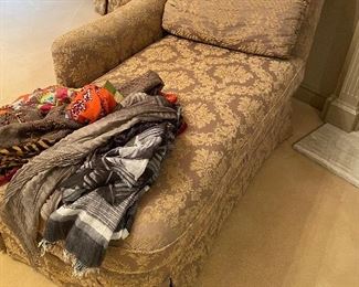 Upholstered chaise lounger and scarves