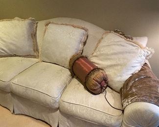 Another view of the camelback 3-cushion couch by Hendredon - with 3 pillows, also shown, custom pillow and beaded throw blanket