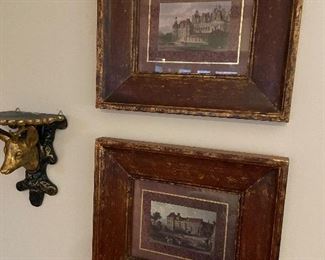 Framed prints and wall sconce