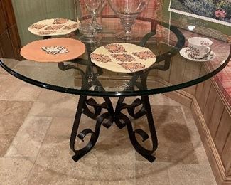 Black metal glass-topped dining/kitchen table, serving plates, and 3 large glass canisters with lids