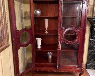 Another view of the large curio cabinet with wood shelves, and inside vases:  Lenox, vintage glass, and mercury glass