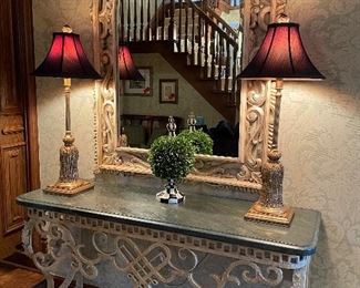 Metal and fossil stone console table, large mirror, buffet lamps by Conrade and MacKenzie topiary