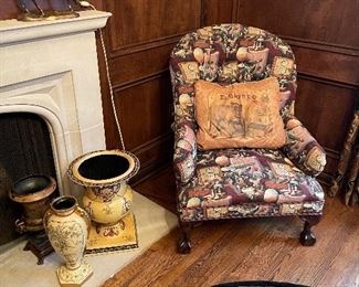 Another view of the bronze horse, "whiskey & cigar" upholstered armchair, and metal and ceramic urns/planters