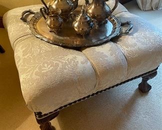 Tufted ottoman with nail-head trim and ball and claw foot 