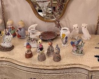 Various figurines, tabletop decor, and perfume bottles