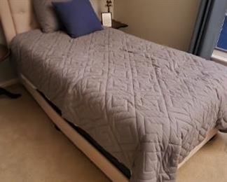 Twin upholstered bed from guest bedroom. Bedding included.