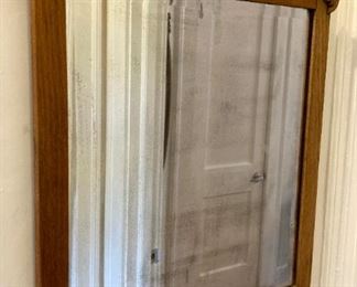 Antique oak-framed beveled mirror
