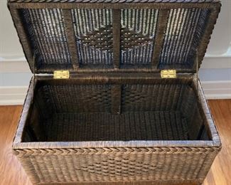 Vintage wicker chest with brass accents and glass table top