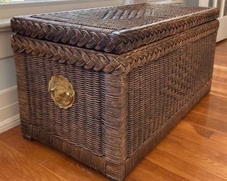 Vintage wicker chest with brass accents and glass table top