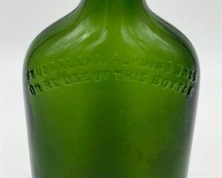 Vintage green glass medicine bottle