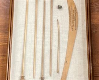 Framed antique knitting and tailor tools