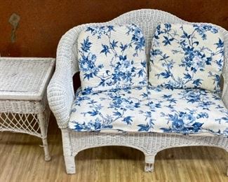 White wicker outdoor love seat (with cushions) and side table