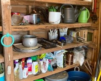 Assorted lawn and garden tools, soils, fertilizers, watering cans, buckets