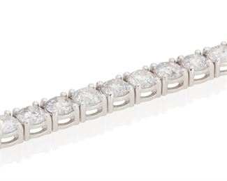 3
A Diamond Line Bracelet
18k white gold; Stamped: 750
Set with forty round full-cut diamond totaling 9.89cts. in weight and graded H-I color and I1/I2 clarity
0.125" W x 7.125" L
15.6 grams
Estimate: $4,500 - $5,500