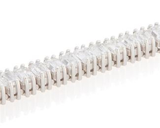 14
A Diamond Line Bracelet
14k white gold; Stamped: D14.36 / 14k / JRM
Set with fifty-seven cut-cornered emerald-cut diamonds totaling 14.36cts. in weight and graded E-G color and VS clarity
0.1875" W x 7.0" L
18.1 grams
Estimate: $20,000 - $25,000