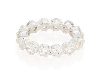 18
A Diamond Eternity Band
Platinum
Comprising of fourteen round full-cut diamonds totaling 6.96cts. in weight and graded G-H color and SI2-I2 in clarity
Ring size: 8
9.6 grams
Estimate: $3,500 - $4,500