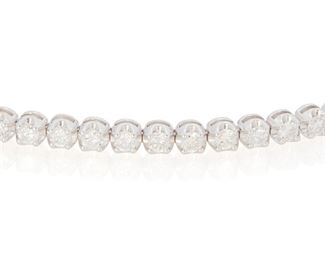19
A Diamond Bolo Bracelet
14k white gold
Set with thirty-three round full-cut diamonds totaling 2.84cts. in weight and graded H-I color and SI2/I1 clarity with an adjustable bolo style clasp
Adjustable length
10.6 grams
Estimate: $1,500 - $2,000