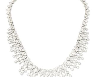20
A Diamond Fringe Necklace
18k white gold; Stamped: K18 / JT
Set with two hundred seventy-four round full-cut diamonds totaling 7.59cts. in weight and graded G-H color and SI clarity
1.125" H x 16.0" L
62.4 grams
Estimate: $10,000 - $15,000