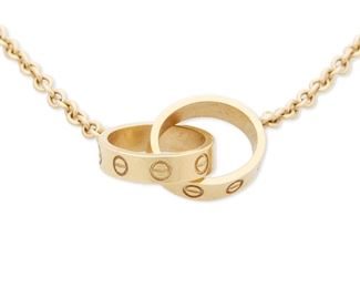 23
A Cartier LOVE Necklace
18k yellow gold; Stamped: Cartier / 750 / © / XY 2385 / Assay marks
Featuring two interlocking rings on an attached neck chain
0.375" W x 17.0" L
6.5 grams
Estimate: $1,000 - $1,500