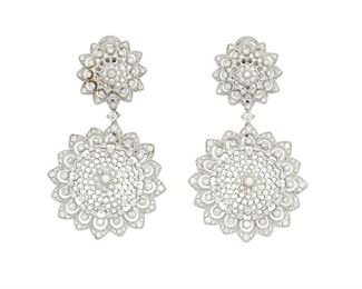 33
A Pair Of Diamond Ear Pendants
18k white gold
Of snowflake design, the earrings are set with two hundred eighty-six round full-cut diamonds totaling 2.81cts in combined weight. and graded H-I color and SI clarity
1.25" W x 2.125" H
22.7 grams
2 pieces
Estimate: $4,000 - $6,000