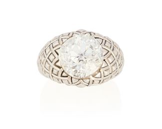 34
A Friedrich Diamond Ring
Platinum and 18k gold; Stamped: Friedrich / 950 / 750
Set with a cushion modified brilliant-cut diamond gauged at 11.36mm x 10.84mm x 8.49mm weighing 6.75cts. with a GIA report dated March 15, 2022 stating J color and VS1 clarity mounted in a ring with a basketweave design signed Friedrich
Ring size: 5.75
28.0 grams
2 pieces
Estimate: $80,000 - $100,000
