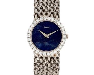 43
A Piaget Lapis Lazuli Wristwatch
18k white gold
A circular lapis lazuli blue dial with white gilt dauphine hands, signed Piaget
with a jeweled stem wind and set movement (not examined) within an 18k white gold case with an integrated bracelet, bezel set with thirty round cut diamonds and a mesh bracelet, hallmarked, #9190 N 38 186389
25mm Dia x 6.5" L
52 grams
Estimate: $1,500 - $2,000