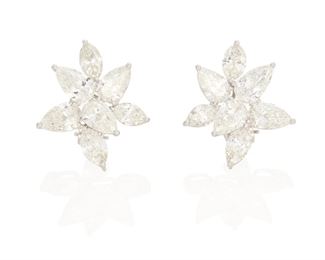 48
A Pair Of Diamond Cluster Ear Clips
Platinum and 18k white gold; Stamped: PT950 / 750
Set with fourteen pear-shaped and marquise-cut diamonds totaling 10.69cts. in weight with fourteen GIA reports/dossiers one dated November 29, 2017 stating the pear brilliant-cut diamond weighs 1.00ct. and graded I color and SI2 clarity, one dated June 15, 2021 stating the pear brilliant-cut diamond weighs 0.91ct. and graded G color and SI1 clarity, one dated July 26, 2021 stating the pear brilliant-cut diamond weighs 0.90ct. and graded I color and SI2 clarity, one dated August 4, 2021 stating the pear brilliant-cut diamond weighs 0.90ct. and graded H color and SI1 clarity, one dated July 26, 2021 stating the pear brilliant-cut diamond weighs 0.90ct. and graded H color and SI2 clarity, one dated July 14, 2021 stating the pear brilliant-cut diamond weighs 0.90ct. and graded I color and SI2 clarity, and one dated July 7, 2021 stating the pear brilliant-cut diamond weighs 0.90ct. and graded I color an