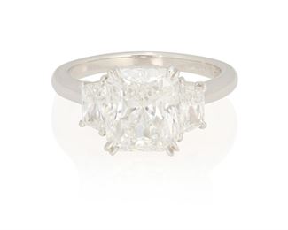 49
A Diamond Ring
Platinum; Stamped: PT950 / KG
Centering a cut-cornered rectangular modified brilliant-cut diamond weighing 3.08cts. with a GIA report dated November 30, 2022 stating F color and VS1 clarity, flanked by two trapezoid-cut diamonds totaling 0.77ct. in weight and graded E-F color and VS clarity
Ring size: 6
6.1 grams
Estimate: $65,000 - $75,000