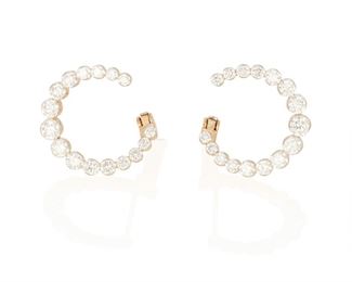 50
A Pair Of Diamond Earrings
18k yellow gold
Of a crescent moon design, the hoop style earrings are set with thirty-two round full-cut diamonds totaling 1.62cts. and graded H-I color and SI clarity
0.625" Dia
3.5 grams
2 pieces
Estimate: $2,500 - $3,000