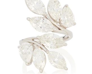 53
A Diamond Ring
Platinum; Stamped: PT950
Set with eight marquise-cut and pear-shaped diamonds totaling 7.71cts. in weight with eight GIA reports/dossiers one dated June 22, 2022 stating the marquise brilliant-cut diamond weighs 1.01cts. and graded J color and VS2 clarity, one dated February 4, 2022 stating the marquise brilliant-cut diamond weighs 1.01cts. and graded J color and VS2 clarity, one dated September 9, 2020 stating the pear brilliant-cut diamond weighs 1.01cts. and graded J color and SI1 clarity, one dated September 9, 2020 stating the pear brilliant-cut diamond weighs 1.00ct. and graded H color and VS2 clarity, one dated December 9, 2019 stating the marquise brilliant-cut diamond weighs 0.99ct. and graded H color and VS1 clarity, one dated July 12, 2021 stating the marquise brilliant-cut diamond weighs 0.94ct. and graded H color and SI2 clarity, one dated April 20, 2021 stating the marquise brilliant-cut diamond weighs 0.94ct. and graded J color and SI2 clarity and one d