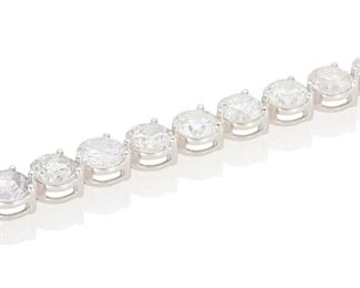 54
A Diamond Line Bracelet
18k white gold; Stamped: 750
Set with twenty-five round full-cut diamonds totaling 25.18cts. in weight and graded H-I color and SI1-I2 in clarity
7.125" L
21.7 grams
Estimate: $35,000 - $45,000