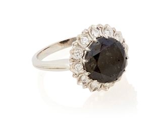 57
A Black Diamond And Near Colorless Diamond Ring
Platinum; Stamped: PLAT
Centering a round full-cut black diamond gauged at 10.3 mm x 10.3mm x 7.8mm weighing approximately 3.40cts. and further set with a halo of twelve round full-cut diamonds totaling approximately 0.30ct. and graded H-I color and SI clarity (0.50" Dia)
Ring Size: 6.5
7.5 grams
Estimate: $3,000 - $5,000
