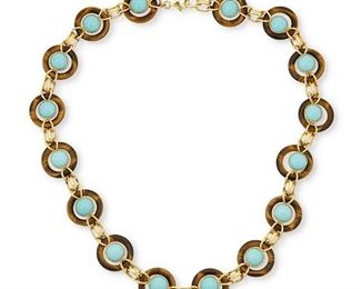 59
A Tiger's Eye And Turquoise Necklace
18k yellow gold; Stamped: 750
Comprising of sixteen carved tiger's eye circles topped with round cabochon bezel set turquoise each gauged at 9.3mm in diameter
0.75" W x 20.5" L
66.4 grams
Estimate: $5,500 - $6,500