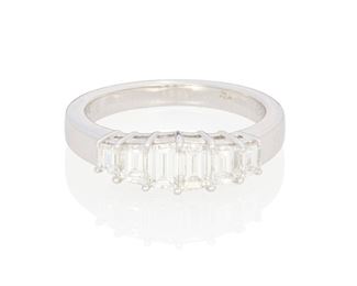 61
A Diamond Ring
Platinum; Stamped: AGC950 / D123
Set with six trapezoid step-cut diamonds graduating in size and totaling 1.23cts. in weight and each graded E-F color and VS clarity
0.1875" W
6.5 grams
Estimate: $2,500 - $3,500