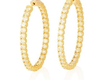 66
A Pair Of Diamond Hoop Earrings
14k yellow gold; Stamped: 585
Set with sixty round full-cut diamonds totaling 6.89cts. in weight and graded yellow in color and SI1-I1 in clarity
1.375" W x 1.75" H
16.5 grams
2 pieces
Estimate: $3,500 - $4,500