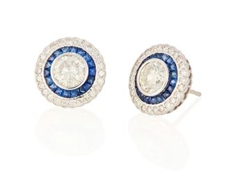 77
A Pair Of Diamond And Sapphire Earrings
18k white gold; stamped: 18k
Centering a 1.00ct. round full-cut diamond and a 1.02cts. round full-cut diamond each graded J-K color and SI1/SI2 clarity further set with a halo of thirty-six calibre-cut sapphires and fifty-two round full-cut diamonds totaling 0.52ct. in weight and graded H-I color and SI clarity with post and push backings
0.50" Dia
5.9 grams
2 pieces
Estimate: $2,500 - $3,500