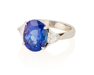 79
A Tanzanite And Diamond Ring
Platinum; Stamped: Plat
Set with an oval mixed-cut tanzanite gauged at 12.2mm x 9.4mm x 6.6mm weighing approximately 5.50cts. in weight and flanked on either side by two triangular mixed-cut diamonds totaling approximately 1.00ct. in weight and graded F-G color and SI clarity
Ring size: 5.75
8.3 grams
Estimate: $4,000 - $6,000
