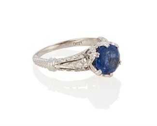 87
A Sapphire And Diamond Ring
18k white gold; Stamped: 18k
Centering an oval mixed-cut sapphire gauged at 8.5mm x 7.4mm x 5.9mm weighing exactly 3.42cts. further accented with thirty-six round full-cut diamonds totaling approximately 0.15ct. in weight
Ring size: 6.5
4.1 grams
Estimate: $800 - $1,200
