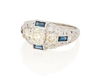 98
A Sapphire And Diamond Three Stone Ring
18k white gold; Stamped: 18k
Centering an old European-cut diamond gauged at approximately 0.80ct. and graded L-M color and SI1 clarity flanked on either side by one old European-cut and one transitional-brilliant cut diamond totaling approximately 0.50ct. in combined weight and each graded K-M in color and VS/SI clarity further surrounded by twenty round full-cut diamonds totaling approximately 0.30ct. and graded H-I color and SI clarity and finished with four baguette-cut sapphires totaling approximately 0.60ct.
Ring size: 7
5.7 grams
Estimate: $2,000 - $3,000