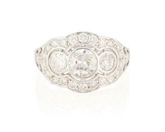 104
A Diamond Three Stone Ring
18k white gold; Stamped: 18k
Comprising of three bezel set old European-cut diamonds totaling 1.28cts. in combined weight and each graded G-H color and VS2-SI2 in clarity further surrounded by twenty-four round full-cut diamonds graded G-H color and VS/SI clarity
Ring size: 7
4.7 grams
Estimate: $2,500 - $3,500