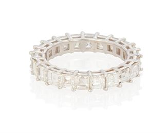 114
A Diamond Eternity Band
18k white gold; Stamped: 18k
Set with twenty-two square step-cut diamonds totaling 4.36cts. in weight and graded G-H color and VS/SI clarity
Ring size: 7
3.9 grams
Estimate: $3,500 - $4,500