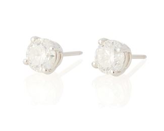 120
A Pair Of Diamond Stud Earrings
18k white gold; Stamped: 750
Set with two round full-cut diamonds weighing 1.20cts. and 1.31cts. and graded H-I color and SI2/I1 clarity
3.6 grams
2 pieces
Estimate: $6,000 - $8,000